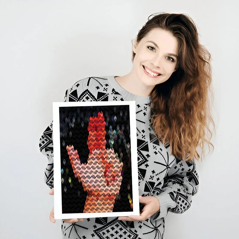 Woman holding a framed artwork of a colorful hand on a white background