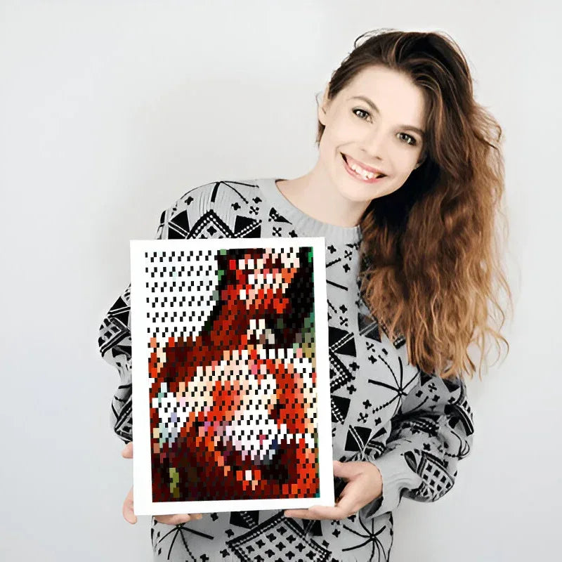 Woman holding a framed artwork with abstract design on a plain background