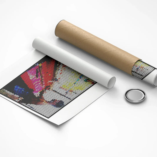 Unrolled poster with a colorful design, roll of paper, and circular object on a white background