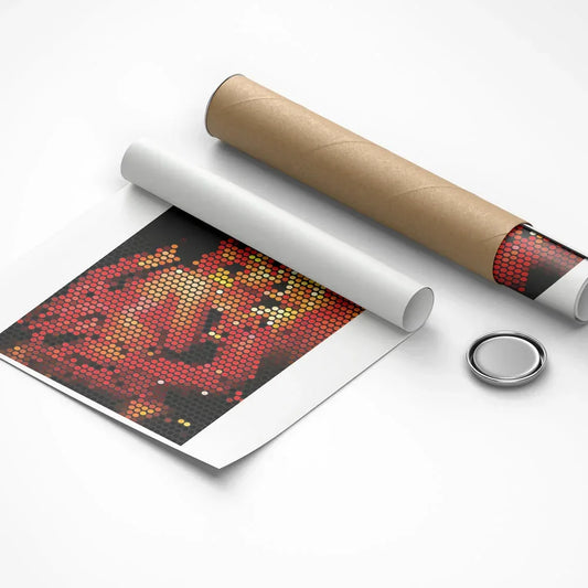 Unrolled poster with a red and black design, cardboard roll, and round silver object on a white background