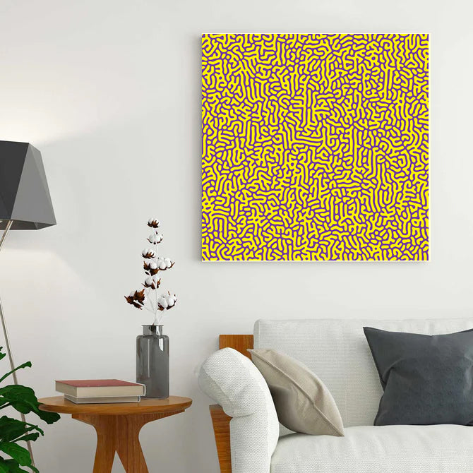 Living room with a yellow abstract patterned painting on the wall, a white sofa, and a side table.