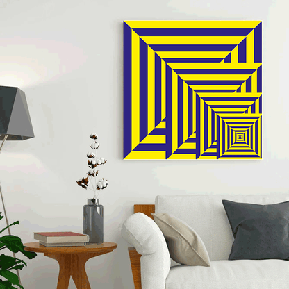 Geometric abstract art piece on a wall in a living room setting.
