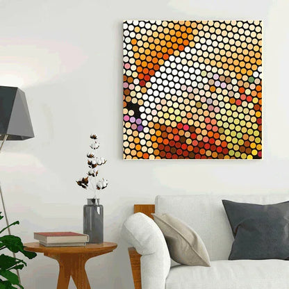 Abstract circular pattern artwork on a wall above a sofa in a living room.