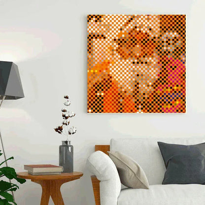 Abstract mosaic artwork on a wall above a sofa in a living room.