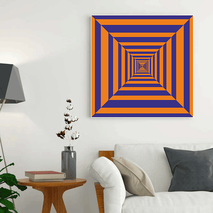 Geometric abstract art piece on a wall in a living room setting.