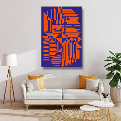 Modern living room with a geometric abstract painting, white sofa, and decorative items.