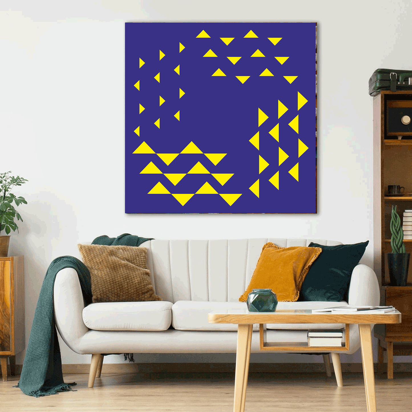 Living room with a white sofa, coffee table, and abstract art on the wall.