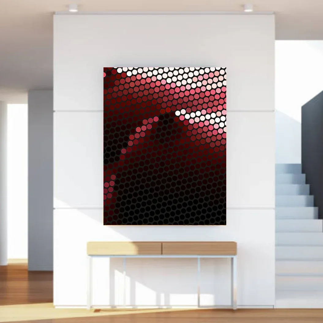Abstract art piece with red and black pattern on a white wall in a modern interior setting.