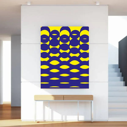 Abstract art with blue and yellow pattern on a white wall above a console table.