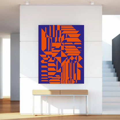 Geometric abstract art in orange and blue on a white wall above a wooden console table.