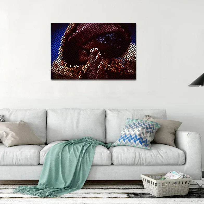Living room with a white sofa, decorative pillows, and a wall art piece.