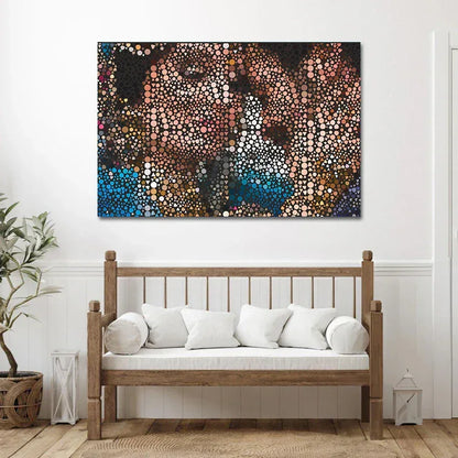 Abstract artwork on a wall above a wooden bench with white cushions.