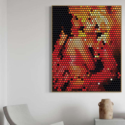 Abstract art piece made of circular elements on a white wall with a chair and vase in the foreground.