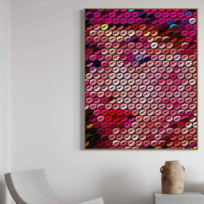 Colorful abstract art piece on a white wall with a chair and vase in the foreground.