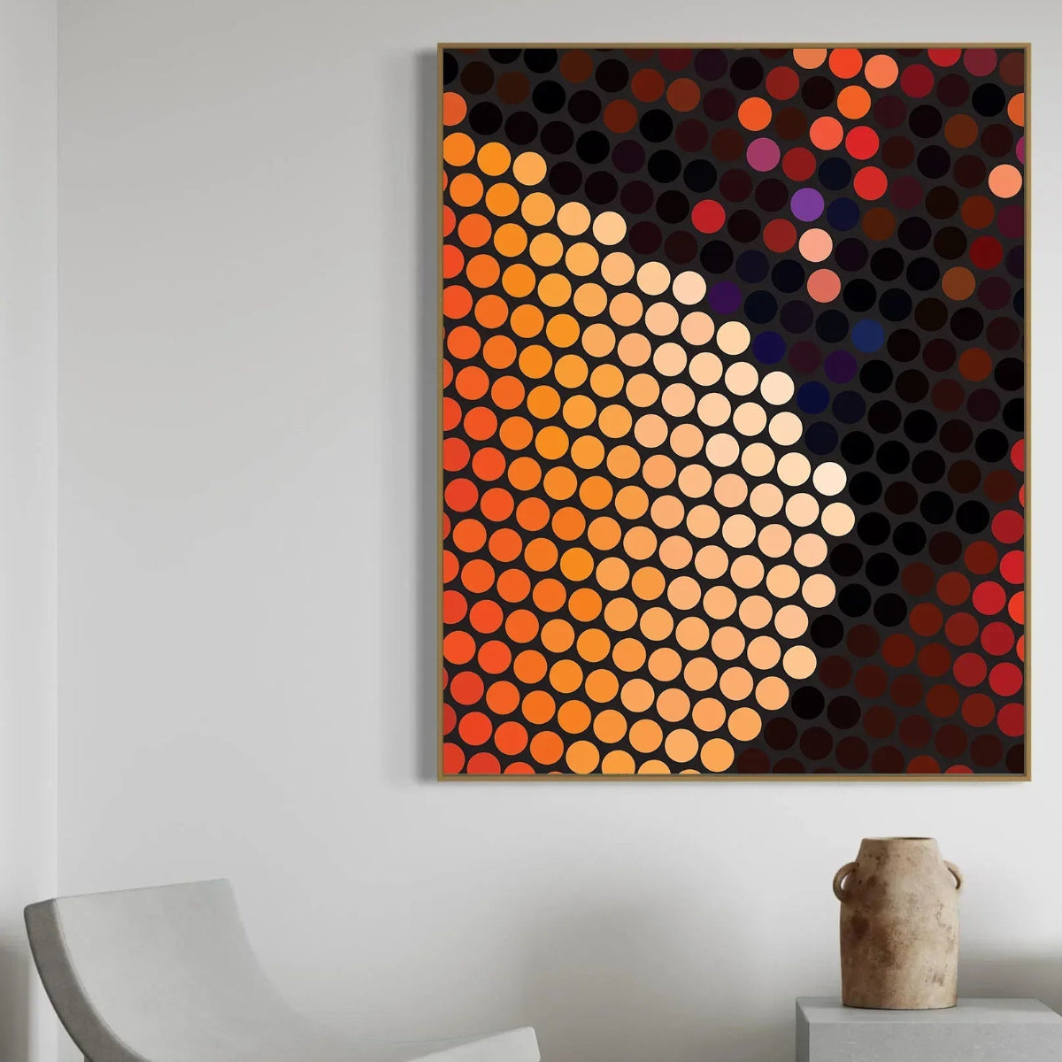 Abstract art piece with colorful dots on a wall in a room with a chair and vase.