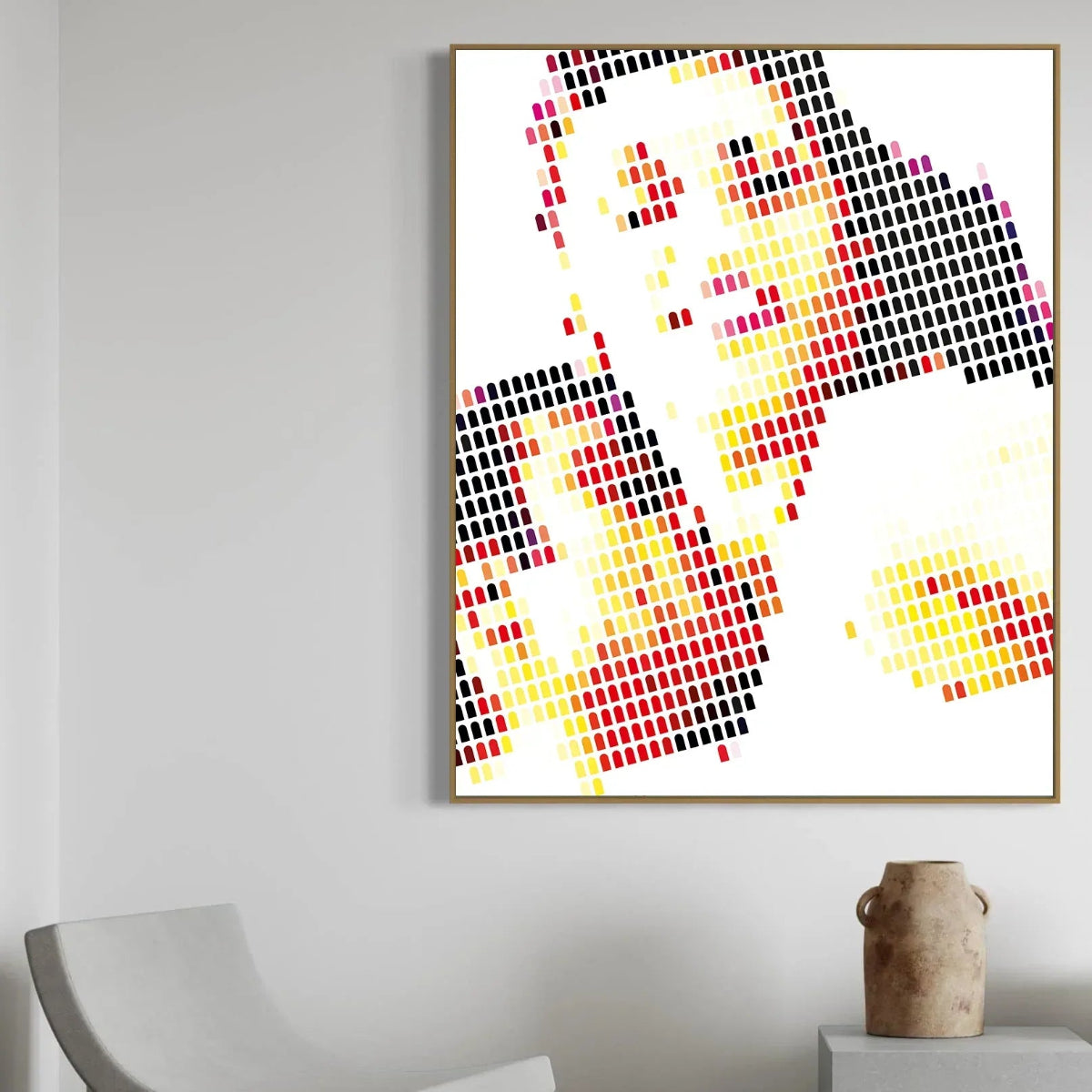 Abstract art piece with colorful geometric design on a white background, framed and hanging on a wall.