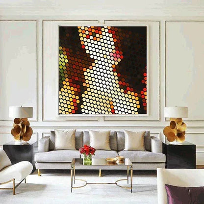 Modern living room with a gray sofa, abstract art, and decorative lamps.