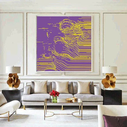 Modern living room with a gray sofa, coffee table, and abstract art on the wall.