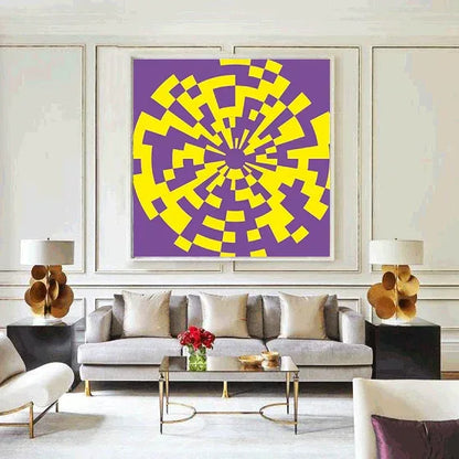 Living room with a gray sofa, coffee table, and abstract art on the wall.