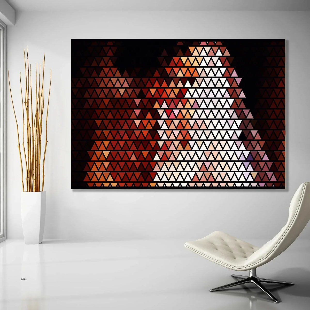 Geometric triangle pattern artwork on a wall with a modern chair and plant in the foreground.