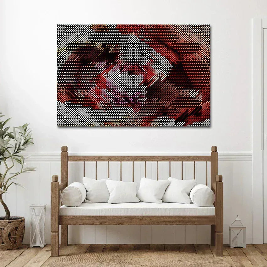 Abstract art piece on a wall above a wooden bench with white cushions.