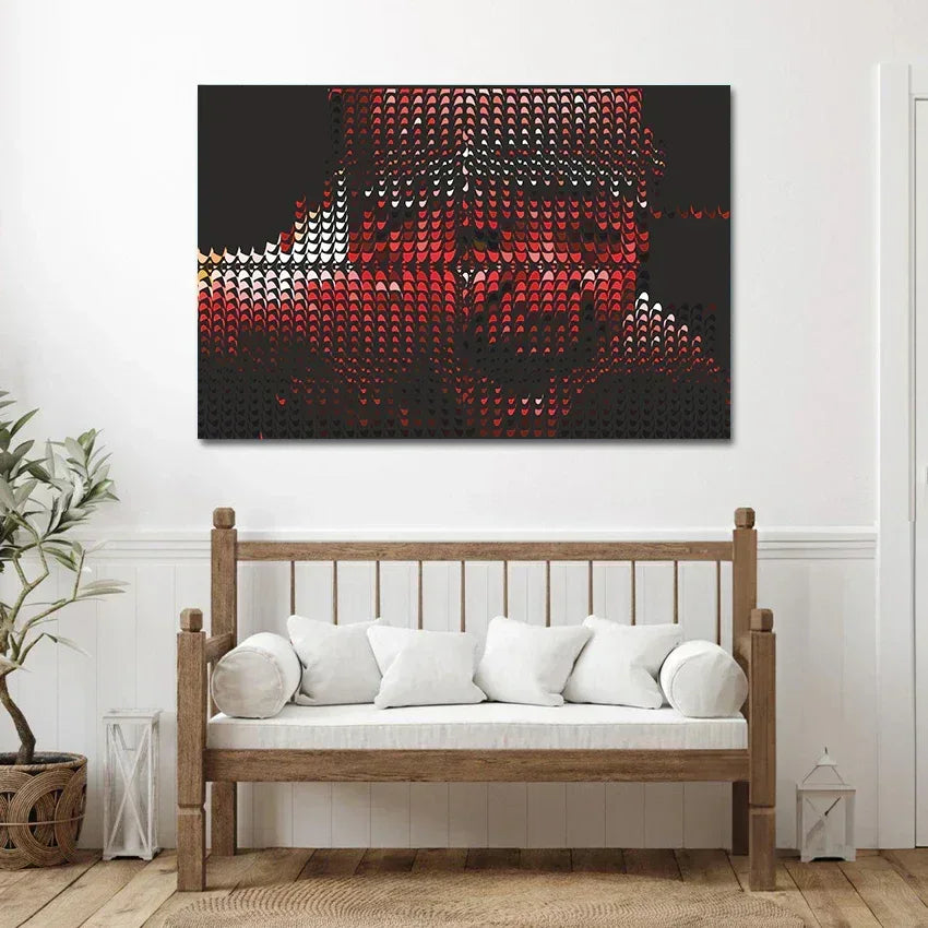 Abstract art piece on a wall above a wooden bench with white cushions.