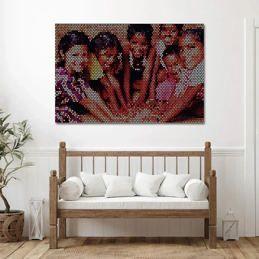 Mosaic artwork of four women on a wall above a wooden bench with white cushions.