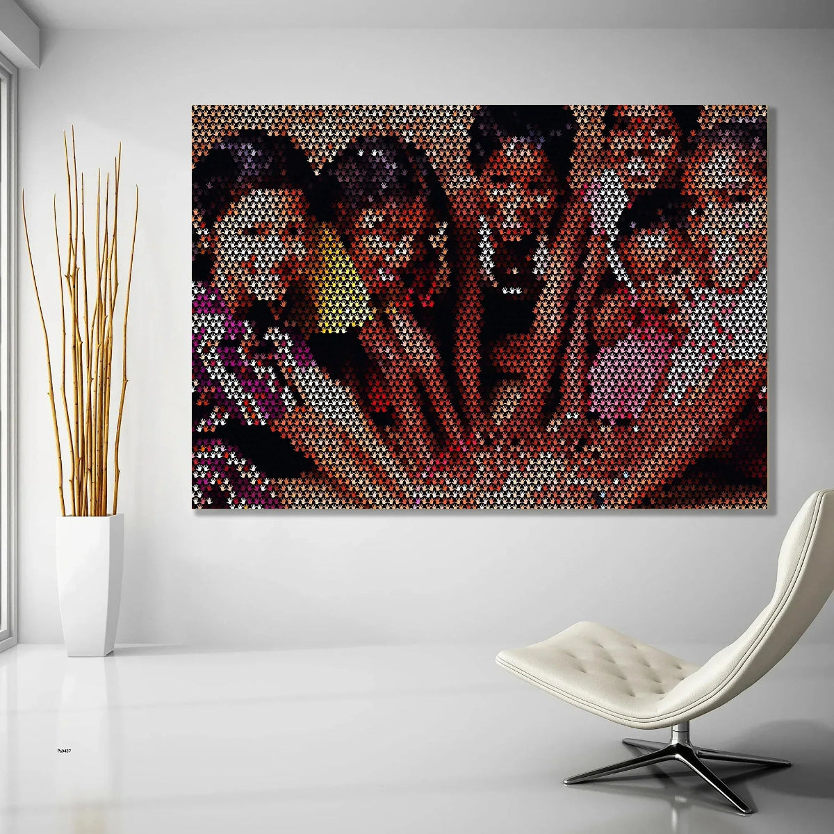 Abstract art piece on a wall with a modern chair and plant in the foreground.