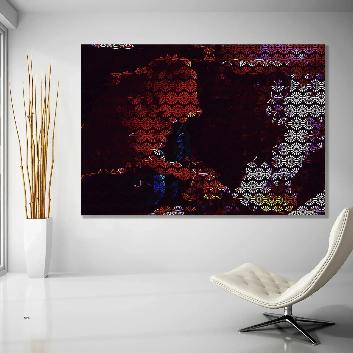 Abstract artwork on a wall with a modern chair and plant in the foreground.