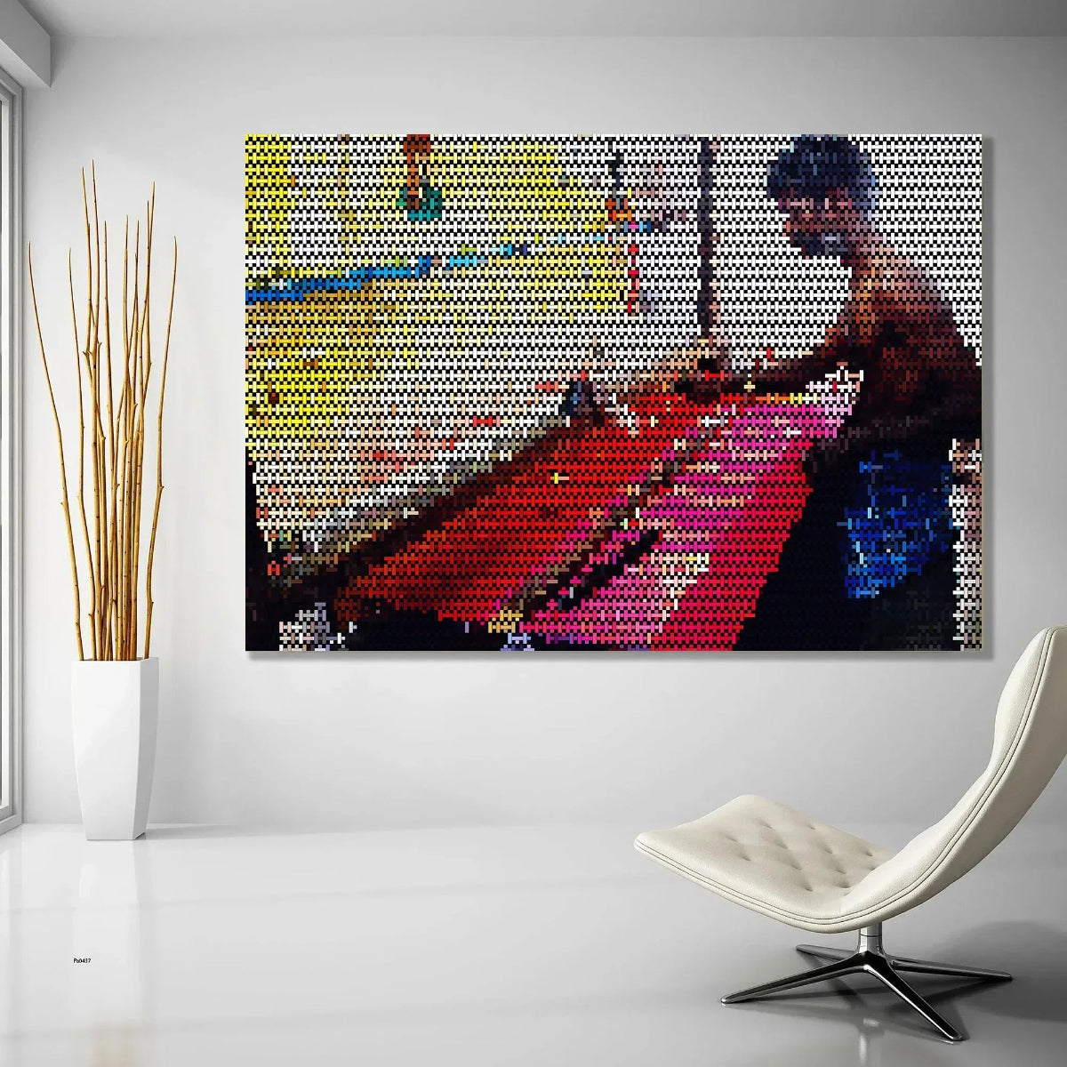 Colorful mosaic art piece on a wall with a modern chair and plant in the foreground.
