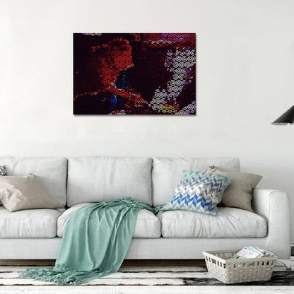 Abstract painting on a wall above a white sofa with decorative pillows.
