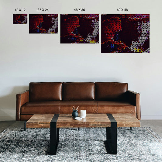 Cozy home self‑care corner with a small dot‑art print above a journal and candle.