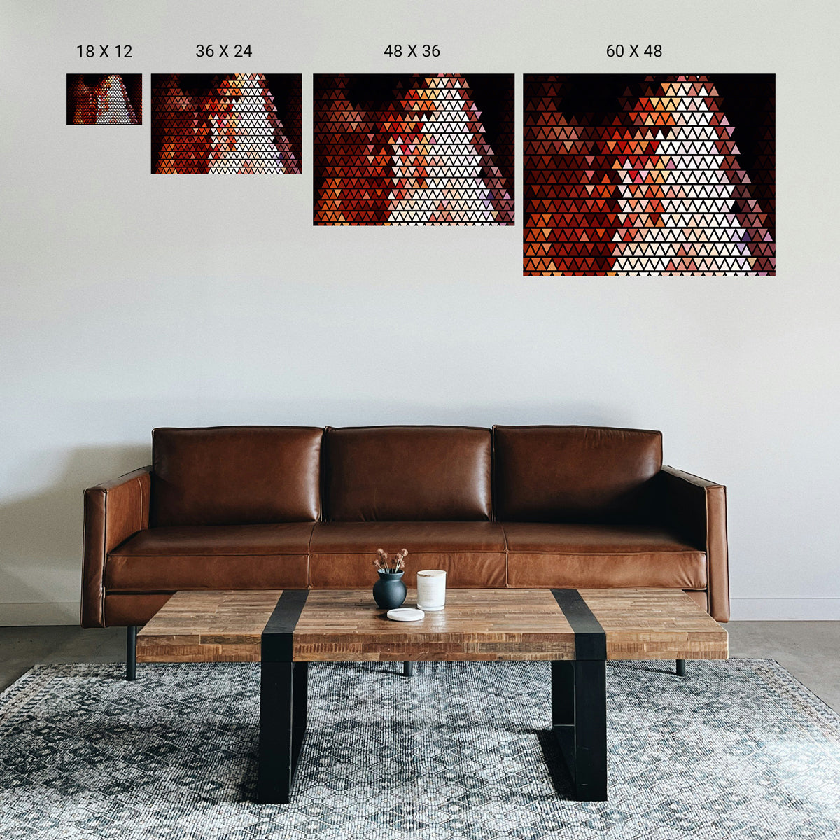 Small consultation room with a single centered symmetry print above a low sofa.