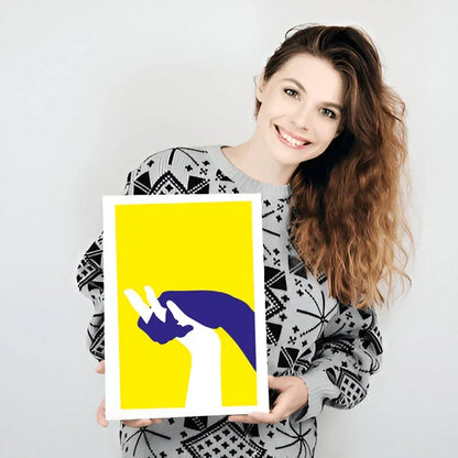Woman holding a yellow and purple abstract art print against a white background