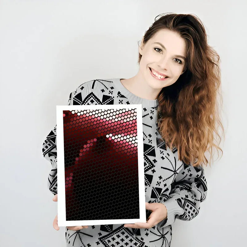 Woman holding a photo frame with a red and black pattern against a white background