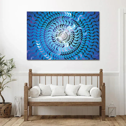 Abstract spiral artwork on a wall above a wooden bench with white cushions.