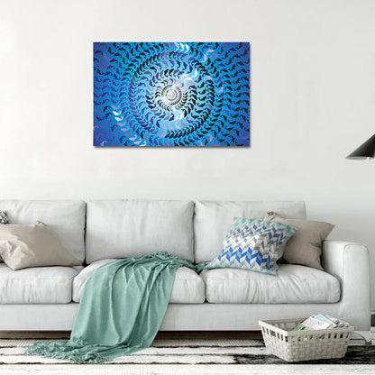 Blue abstract spiral artwork on a white wall above a gray sofa with decorative pillows.