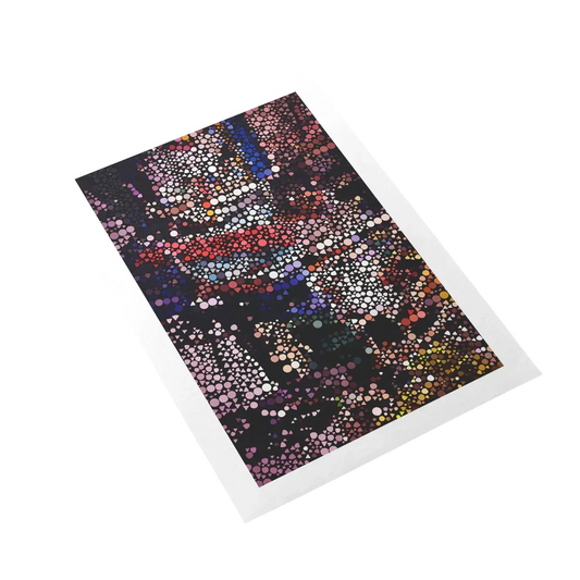 Notebook with colorful dot pattern on a white background