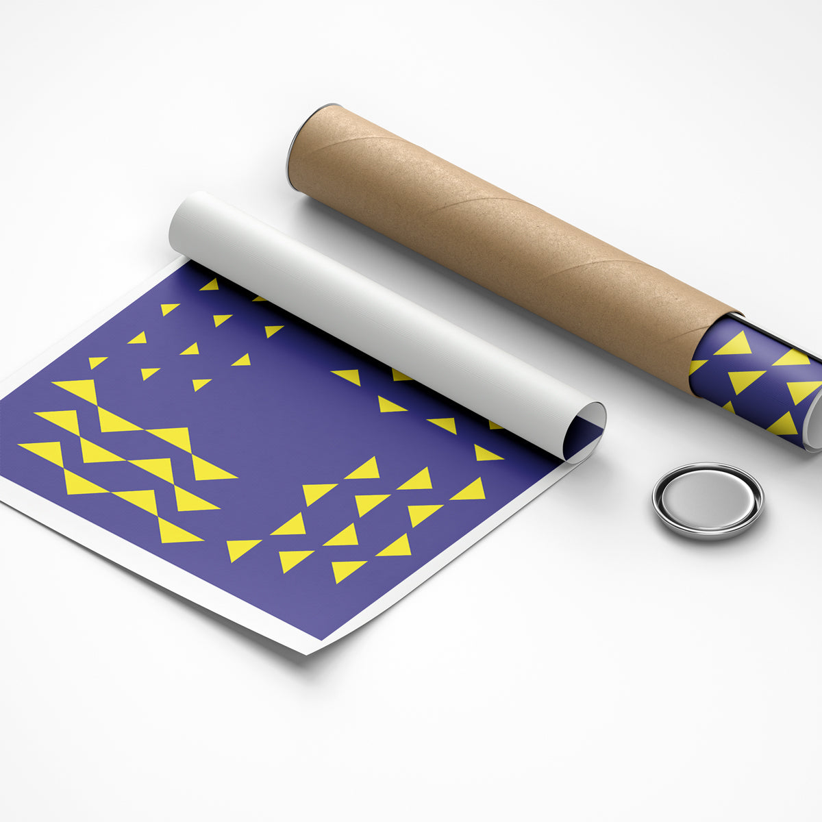 Roll of paper with purple and yellow pattern, cardboard roll, and metal button on a white background