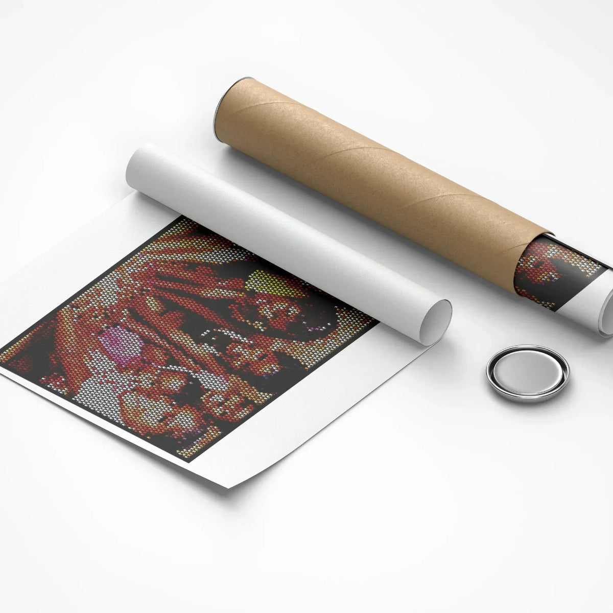 Unrolled poster with a decorative design, cardboard roll, and round metal object on a white background