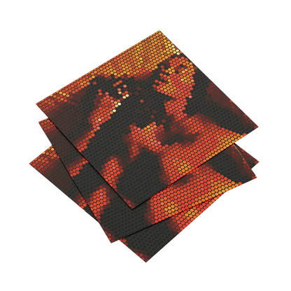 Three pieces of red and black honeycomb-patterned material on a white background