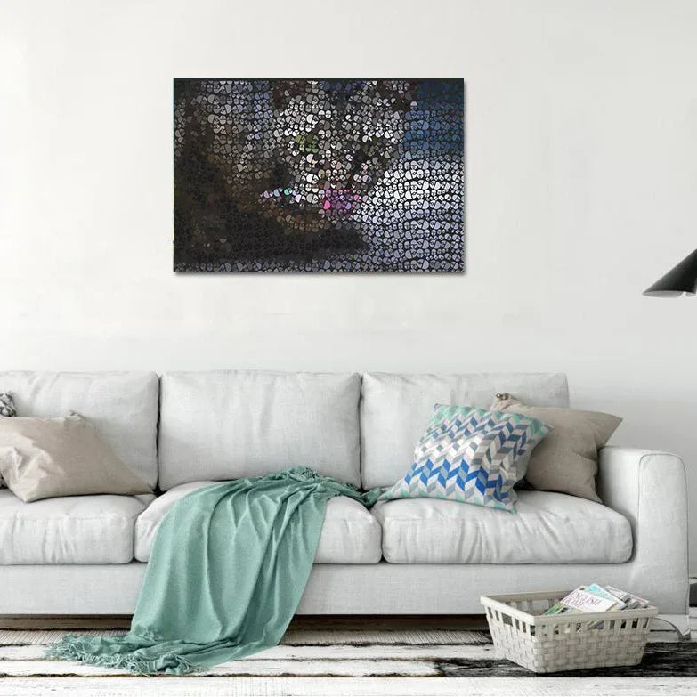 Living room with a white sofa, green blanket, and abstract painting on the wall.