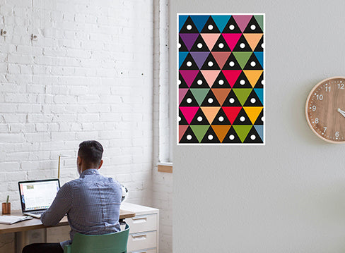 Reception walkway with staggered symmetry prints guiding clients to the lobby.