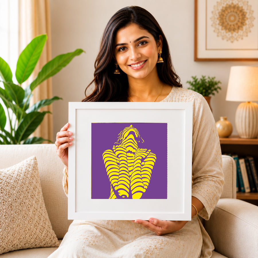 Woman seated holding a white-framed Serenade in Motion print
